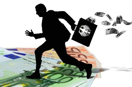 العمل الأبيض في ألمانيا - رجل يركض ويحمل حقيبة تتطاير منها النقود