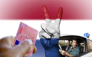 مواطن يقود سيارته الخاصة ويحمل رخصة القيادة في هولندا وعلم هولندا